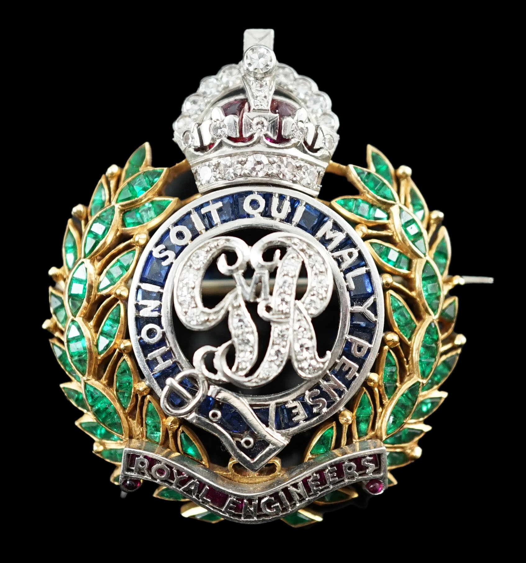 A gold and platinum, ruby, sapphire, emerald and diamond chip set Royal Engineers brooch